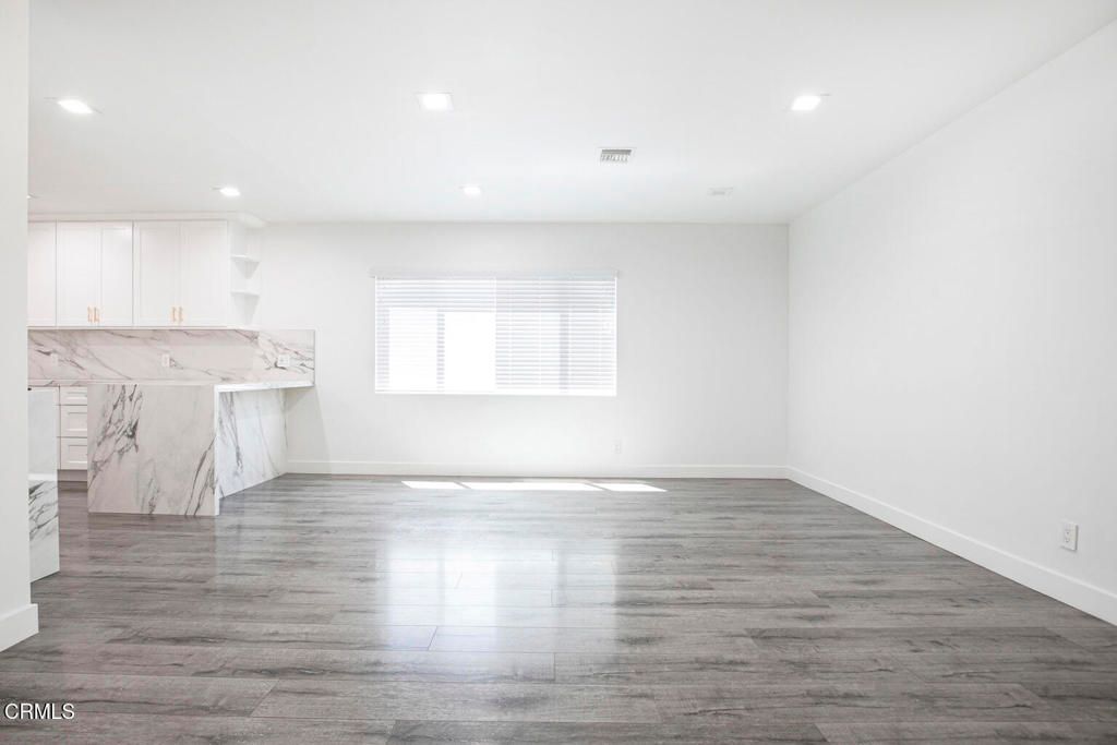 Empty room, Interior, Kitchen, Marble Walls, Recessed Lighting, Wood Texture Flooring