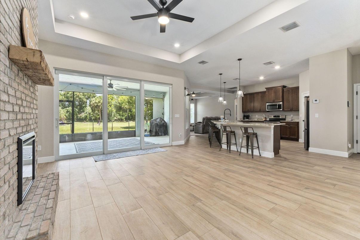 Dining room, Interior, Kitchen, Pendant Lights, Recessed Lighting, Stainless Steel Appliances, Stone Walls, Wood Texture Flooring
