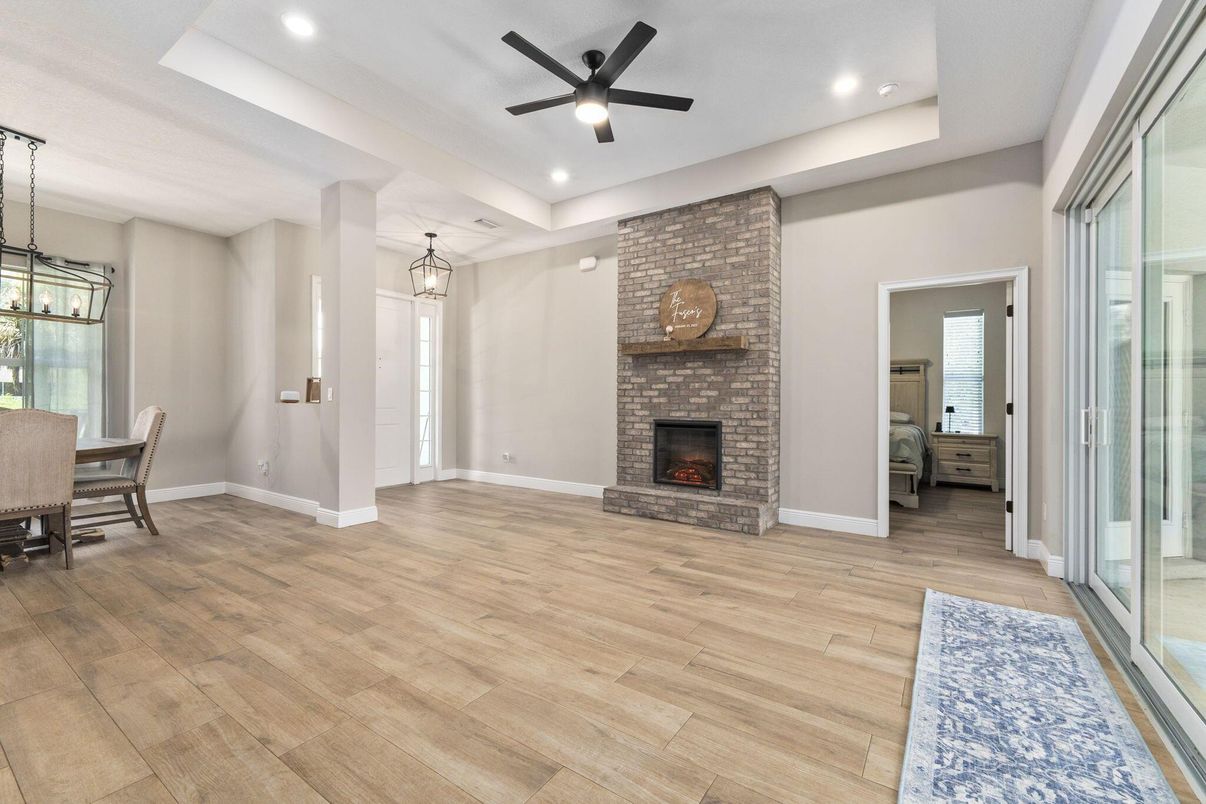Dining room, Fireplace, Interior, Pendant Lights, Recessed Lighting, Stone Walls, Wood Texture Flooring