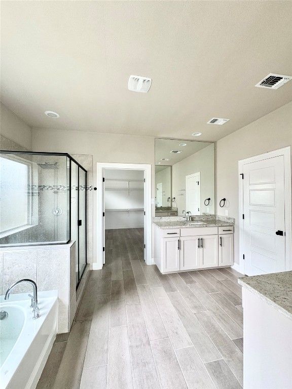 Bathroom, Dual Sink Vanities, Glass Shower, Interior, Recessed Lighting, Wood Texture Flooring