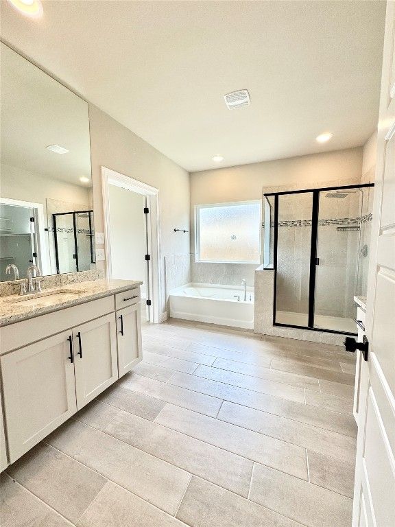 Bathroom, Dual Sink Vanities, Glass Shower, Interior, Recessed Lighting, Wood Texture Flooring