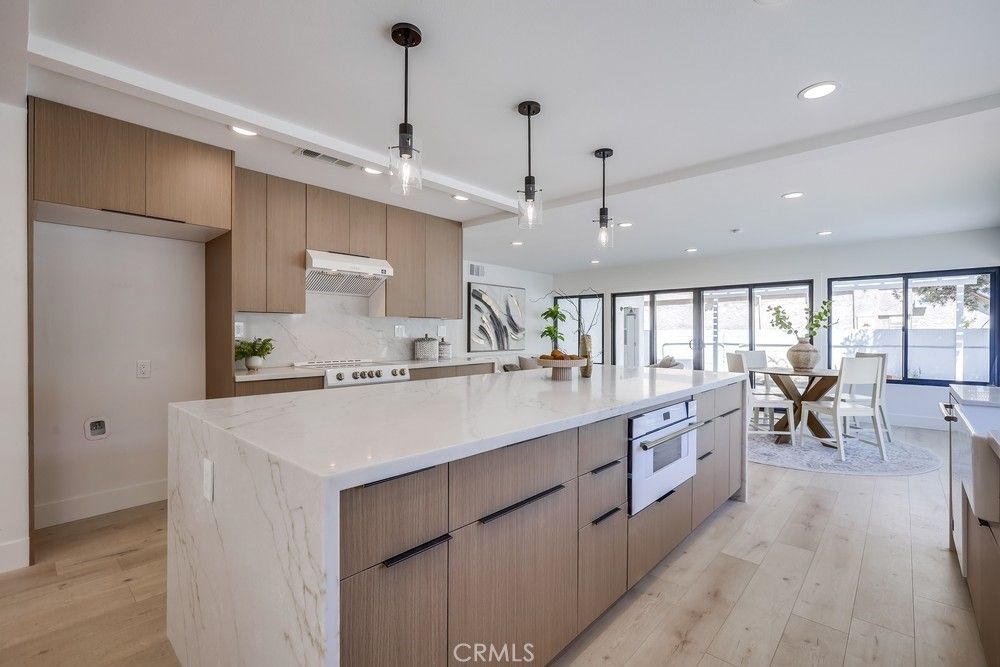 Dining room, Interior, Kitchen, Pendant Lights, Recessed Lighting, Stainless Steel Appliances, Wood Texture Flooring