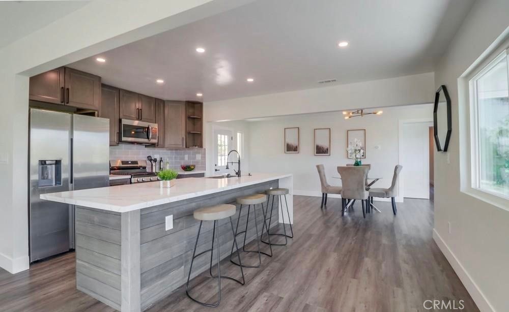 Dining room, Interior, Kitchen, Recessed Lighting, Stainless Steel Appliances, Wood Texture Flooring