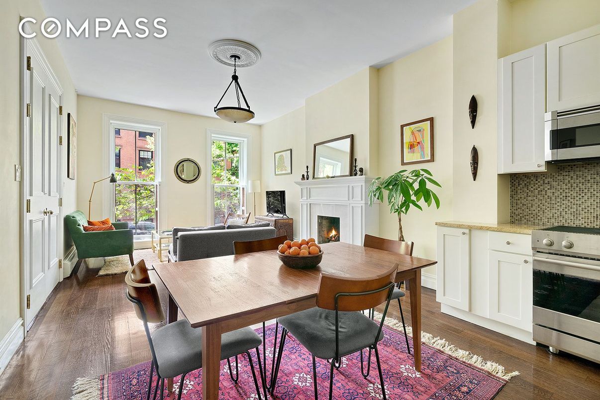 Dining room, Fireplace, Interior, Kitchen, Pendant Lights, Stainless Steel Appliances, Wood Texture Flooring