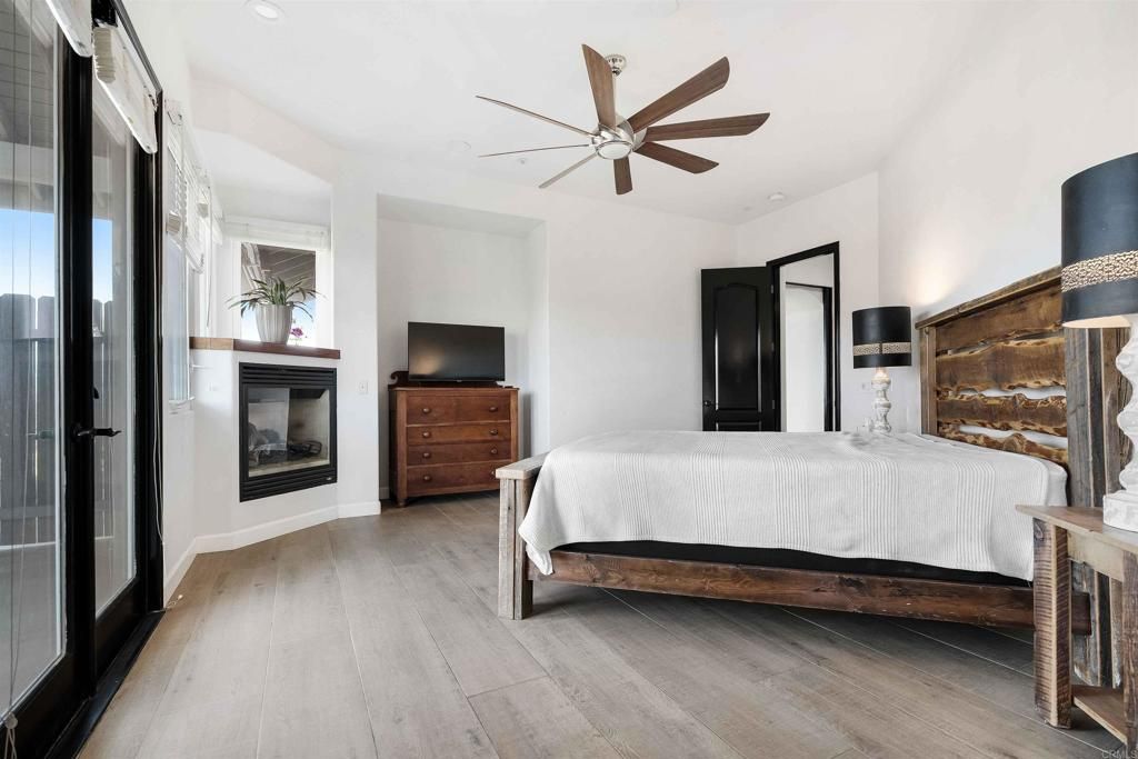 Bedroom, Fireplace, Interior, Recessed Lighting, Wood Texture Flooring