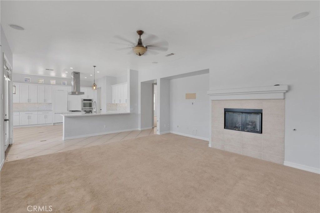 Empty room, Fireplace, Interior, Kitchen, Pendant Lights, Recessed Lighting, Stainless Steel Appliances