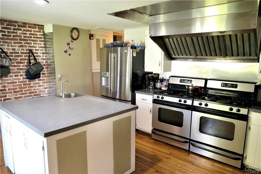 Interior, Kitchen, Recessed Lighting, Stainless Steel Appliances, Stone Walls, Wood Texture Flooring