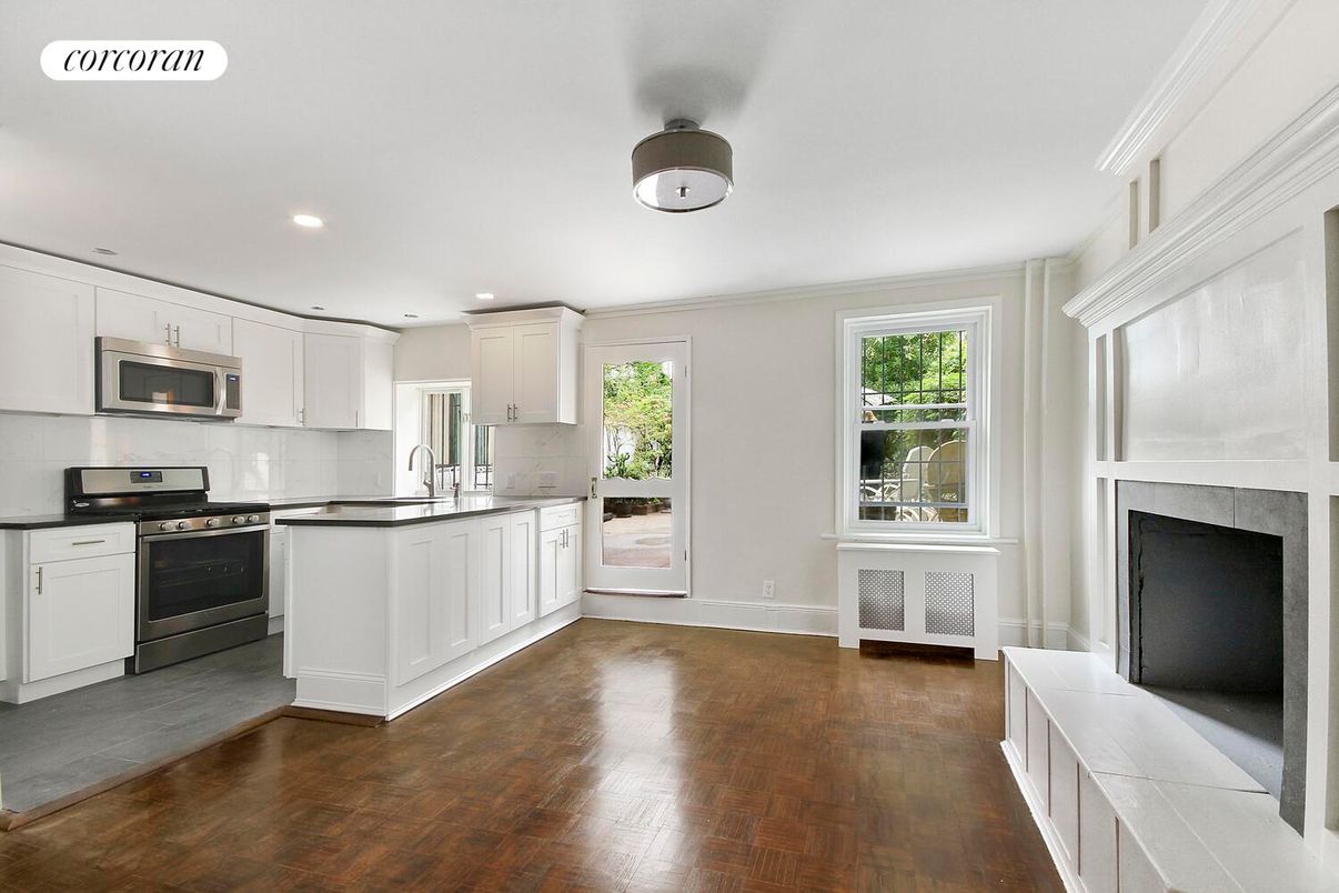 Fireplace, Interior, Kitchen, Recessed Lighting, Stainless Steel Appliances, Wood Texture Flooring