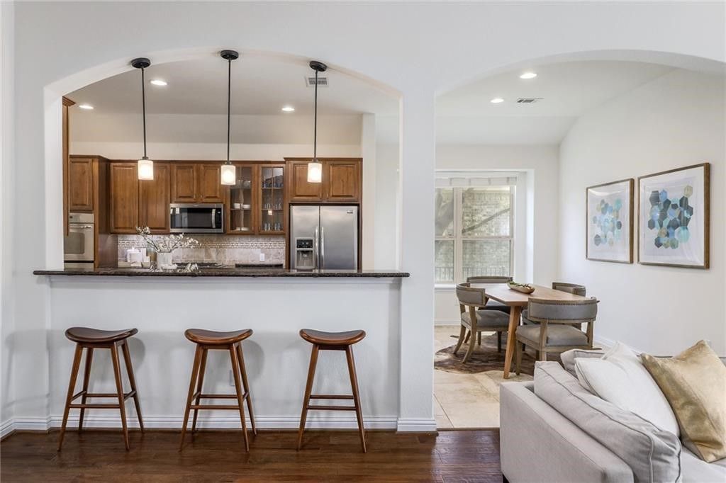 Dining room, Interior, Kitchen, Pendant Lights, Recessed Lighting, Stainless Steel Appliances, Wood Texture Flooring