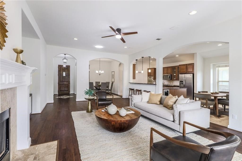 Chandelier, Dining room, Fireplace, Interior, Kitchen, Living room, Pendant Lights, Recessed Lighting, Stainless Steel Appliances, Wood Texture Flooring