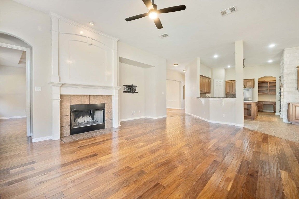 Empty room, Fireplace, Interior, Kitchen, Recessed Lighting, Wood Texture Flooring