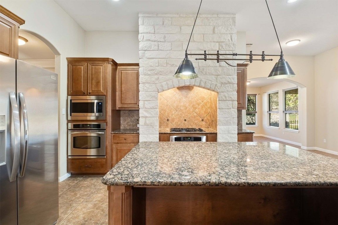 Interior, Kitchen, Pendant Lights, Recessed Lighting, Stainless Steel Appliances, Stone Walls