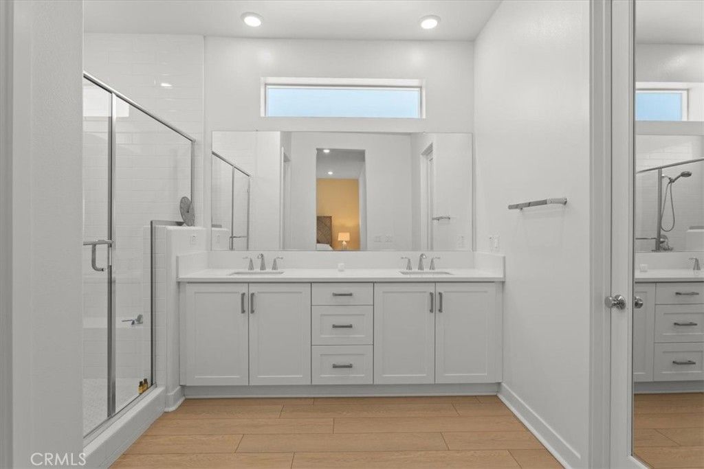 Bathroom, Dual Sink Vanities, Glass Shower, Interior, Recessed Lighting, Wood Texture Flooring