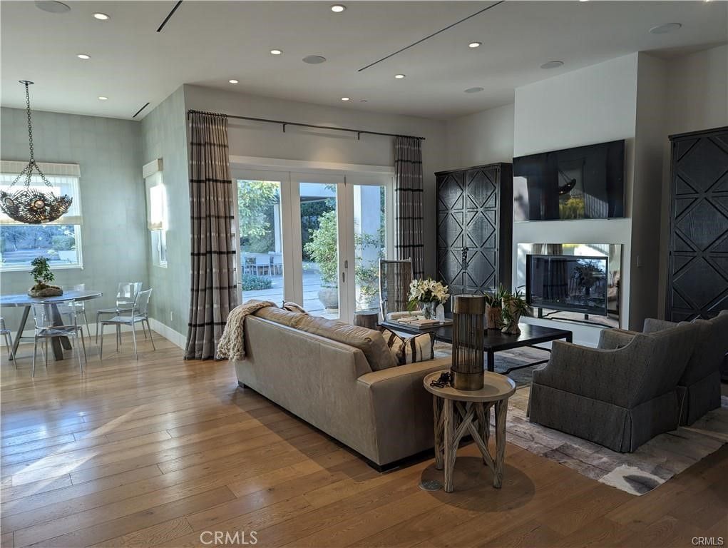 Dining room, Fireplace, Interior, Living room, Pendant Lights, Recessed Lighting, Wood Texture Flooring