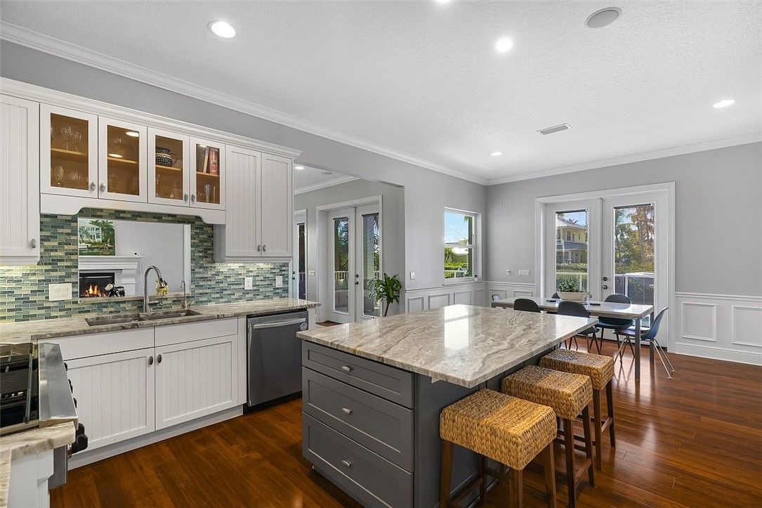 Dining room, Fireplace, Interior, Kitchen, Recessed Lighting, Stainless Steel Appliances, Wood Texture Flooring