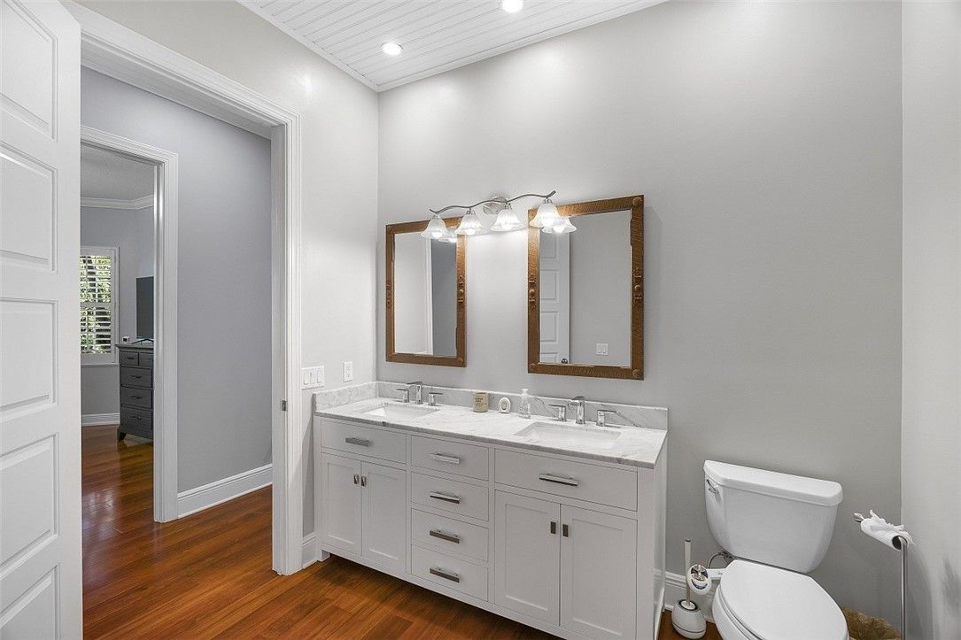 Bathroom, Dual Sink Vanities, Interior, Recessed Lighting, Wood Texture Flooring
