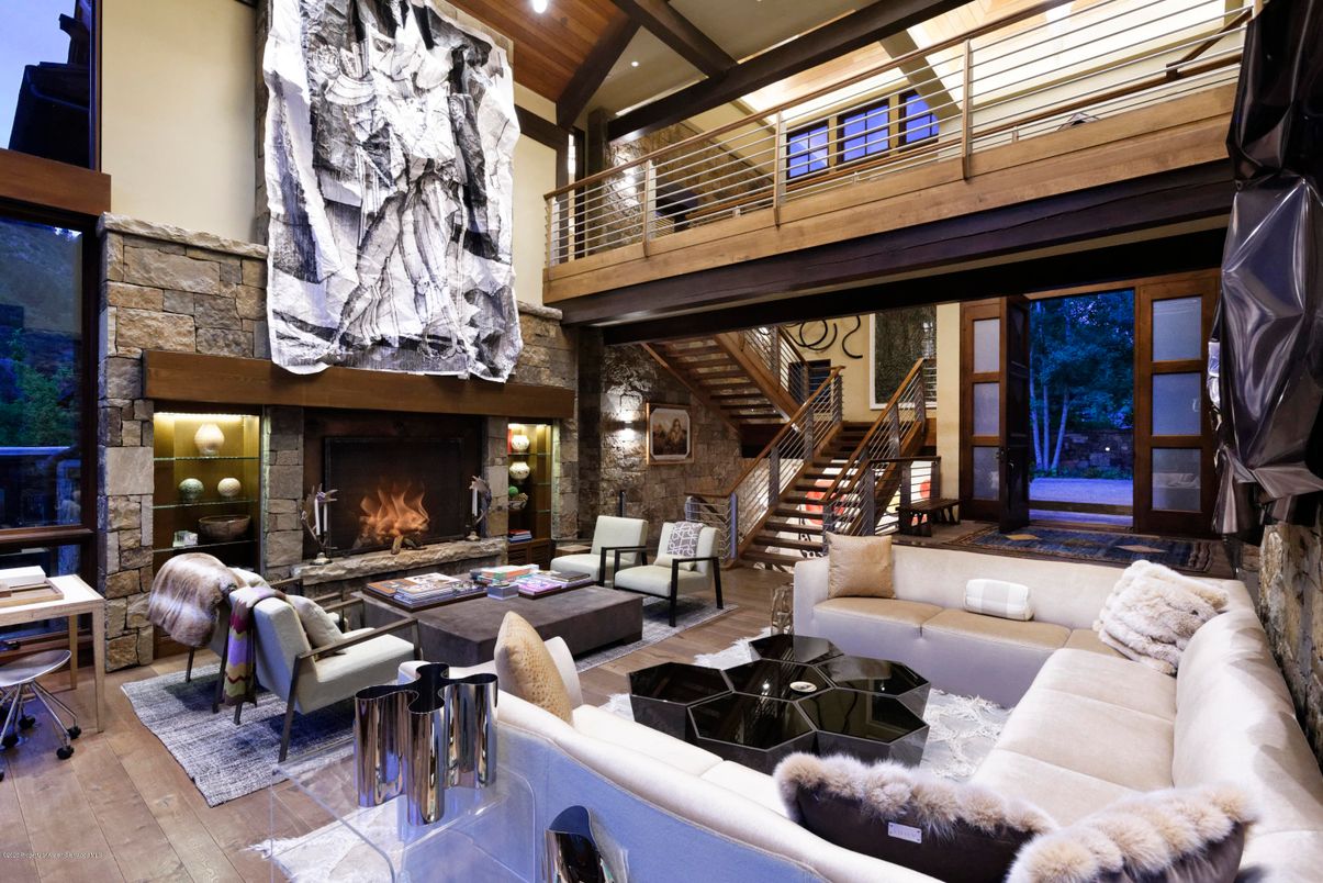 Fireplace, Interior, Living room, Piano, Recessed Lighting, Stone Walls, Wood Texture Flooring