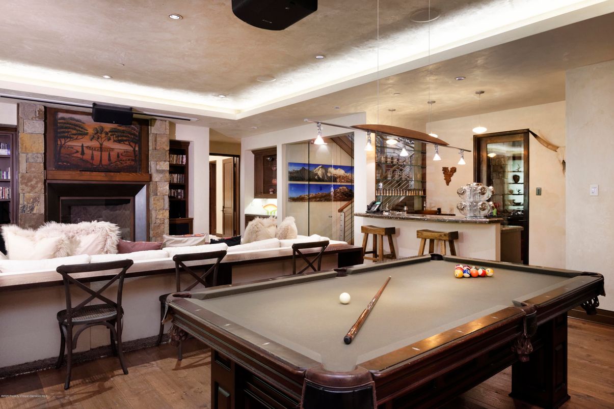 Billiard Table, Fireplace, Game Room, Interior, Living room, Recessed Lighting, Wood Texture Flooring