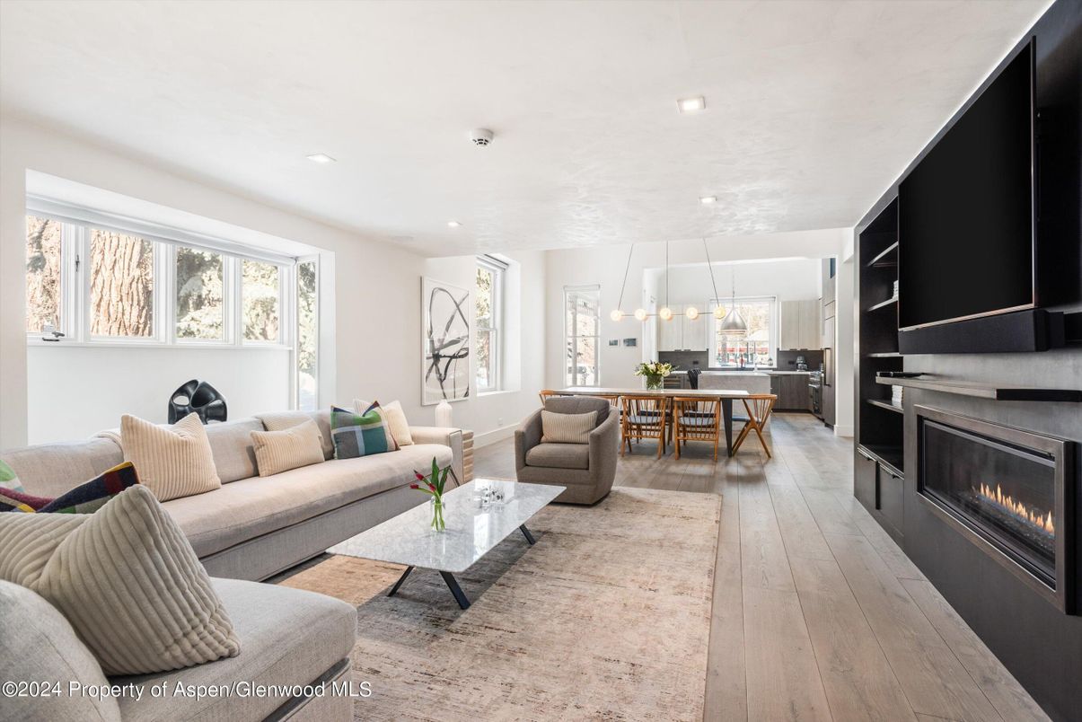 Dining room, Fireplace, Interior, Living room, Pendant Lights, Recessed Lighting, Wood Texture Flooring