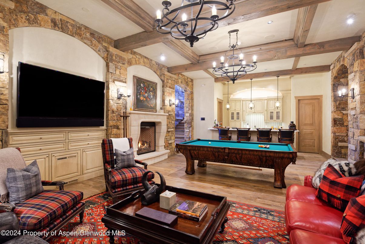 Billiard Table, Chandelier, Fireplace, Game Room, Interior, Recessed Lighting, Stone Walls, Wooden Beams, Wood Texture Flooring