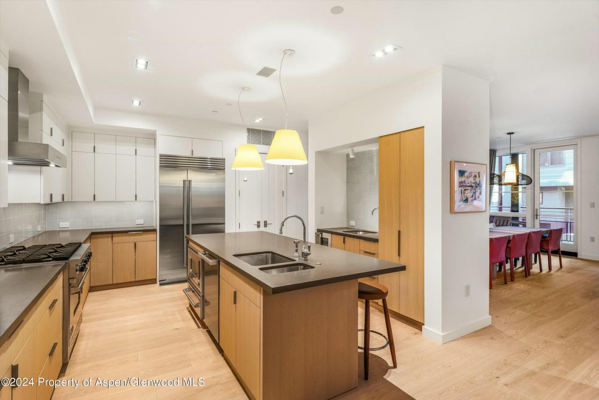 Dining room, Interior, Kitchen, Pendant Lights, Recessed Lighting, Stainless Steel Appliances, Wood Texture Flooring