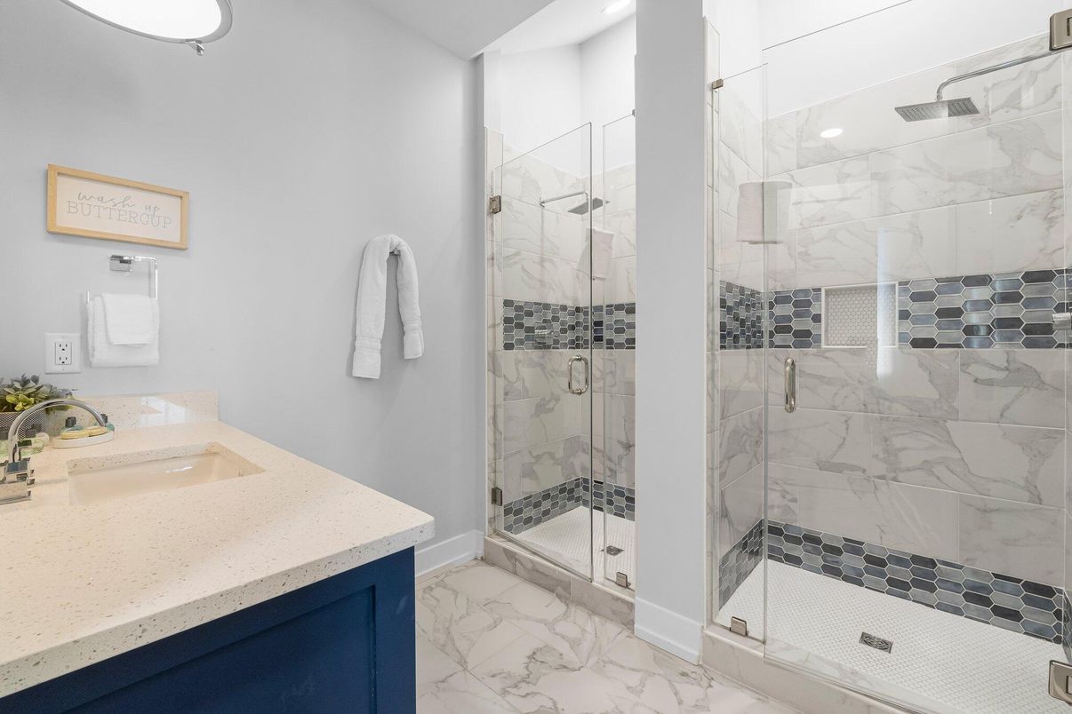 Bathroom, Dual Sink Vanities, Glass Shower, Interior, Marble, Marble Walls, Recessed Lighting