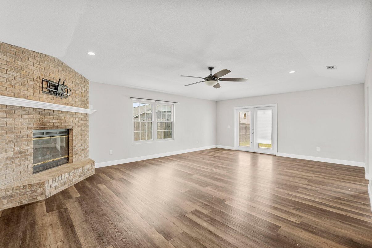 Empty room, Fireplace, Interior, Recessed Lighting, Stone Walls, Wood Texture Flooring