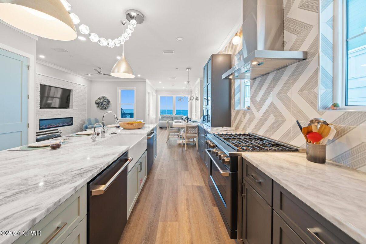 Dining room, Fireplace, Interior, Kitchen, Pendant Lights, Recessed Lighting, Stainless Steel Appliances, Wood Texture Flooring