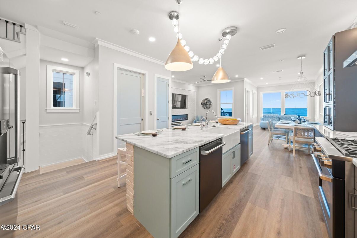 Dining room, Interior, Kitchen, Pendant Lights, Recessed Lighting, Stainless Steel Appliances, Water, Wood Texture Flooring