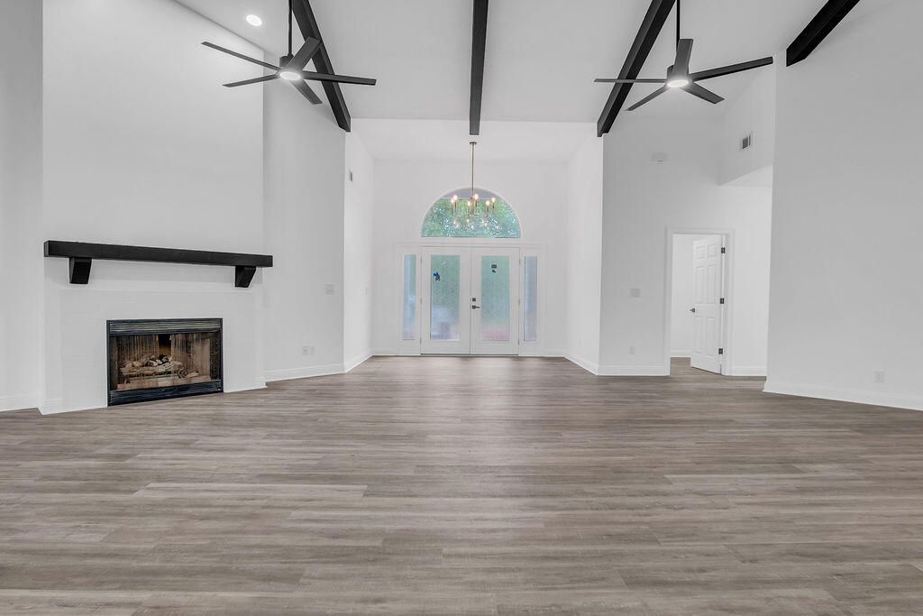 Empty room, Fireplace, Interior, Pendant Lights, Recessed Lighting, Wooden Beams, Wood Texture Flooring