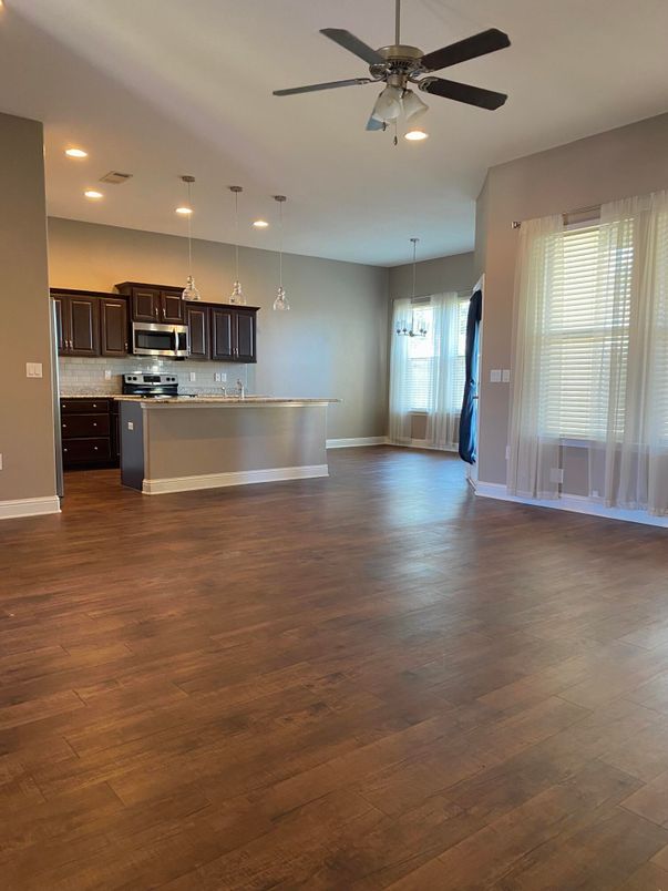 Chandelier, Empty room, Interior, Kitchen, Pendant Lights, Recessed Lighting, Stainless Steel Appliances, Wood Texture Flooring