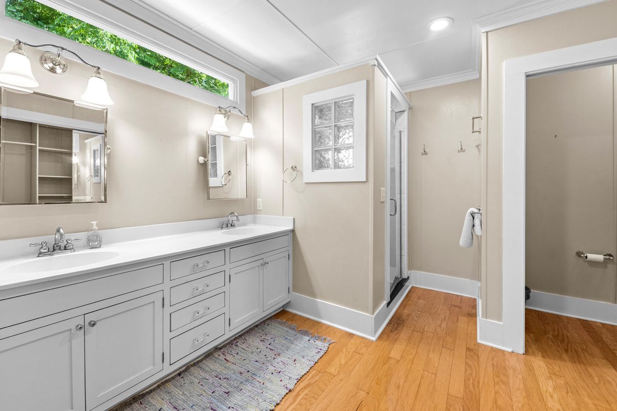 Bathroom, Dual Sink Vanities, Glass Shower, Interior, Recessed Lighting, Wood Texture Flooring