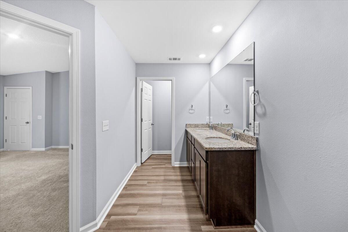 Bathroom, Dual Sink Vanities, Interior, Recessed Lighting, Wood Texture Flooring