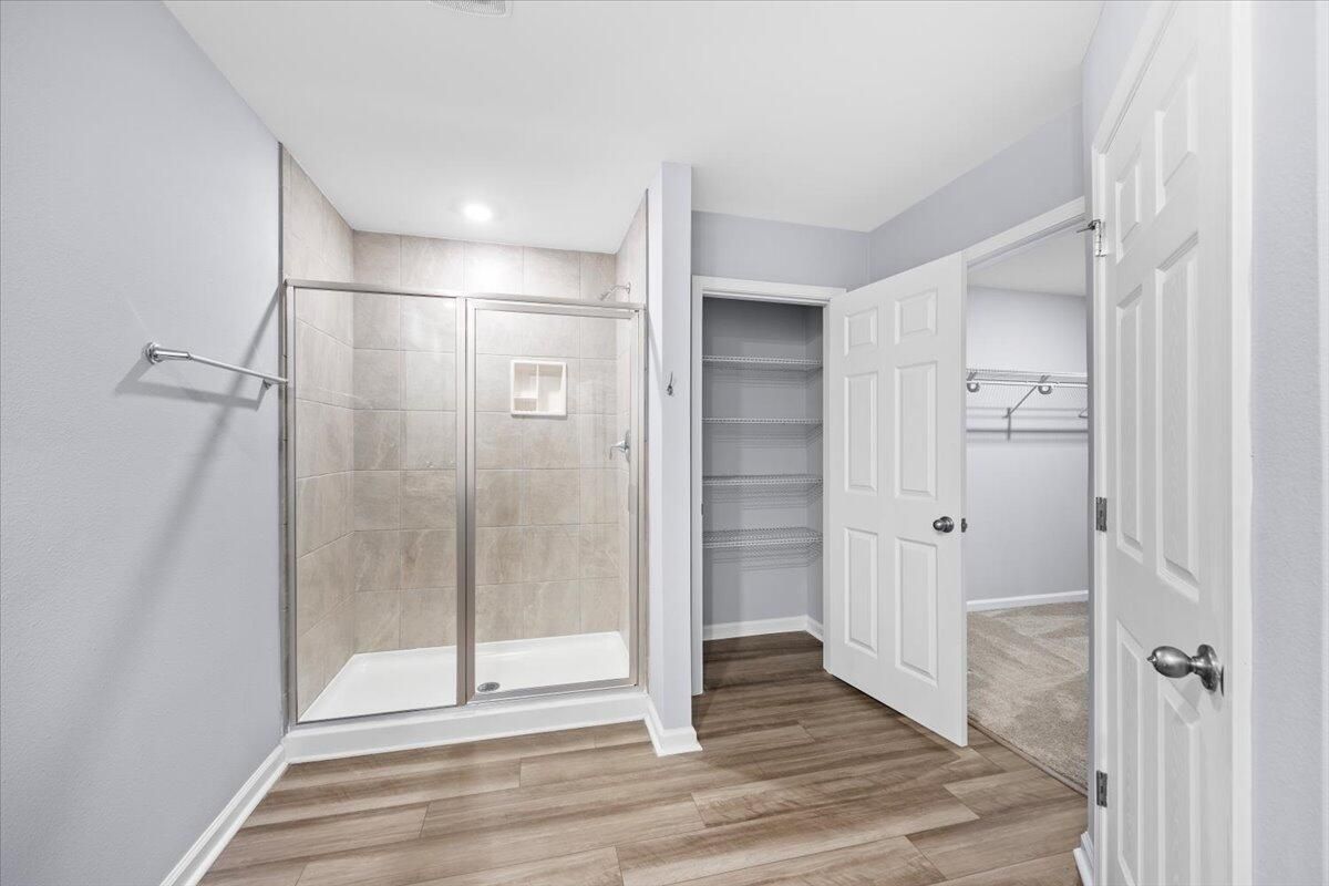 Bathroom, Glass Shower, Interior, Recessed Lighting, Walk-in Closets, Wood Texture Flooring