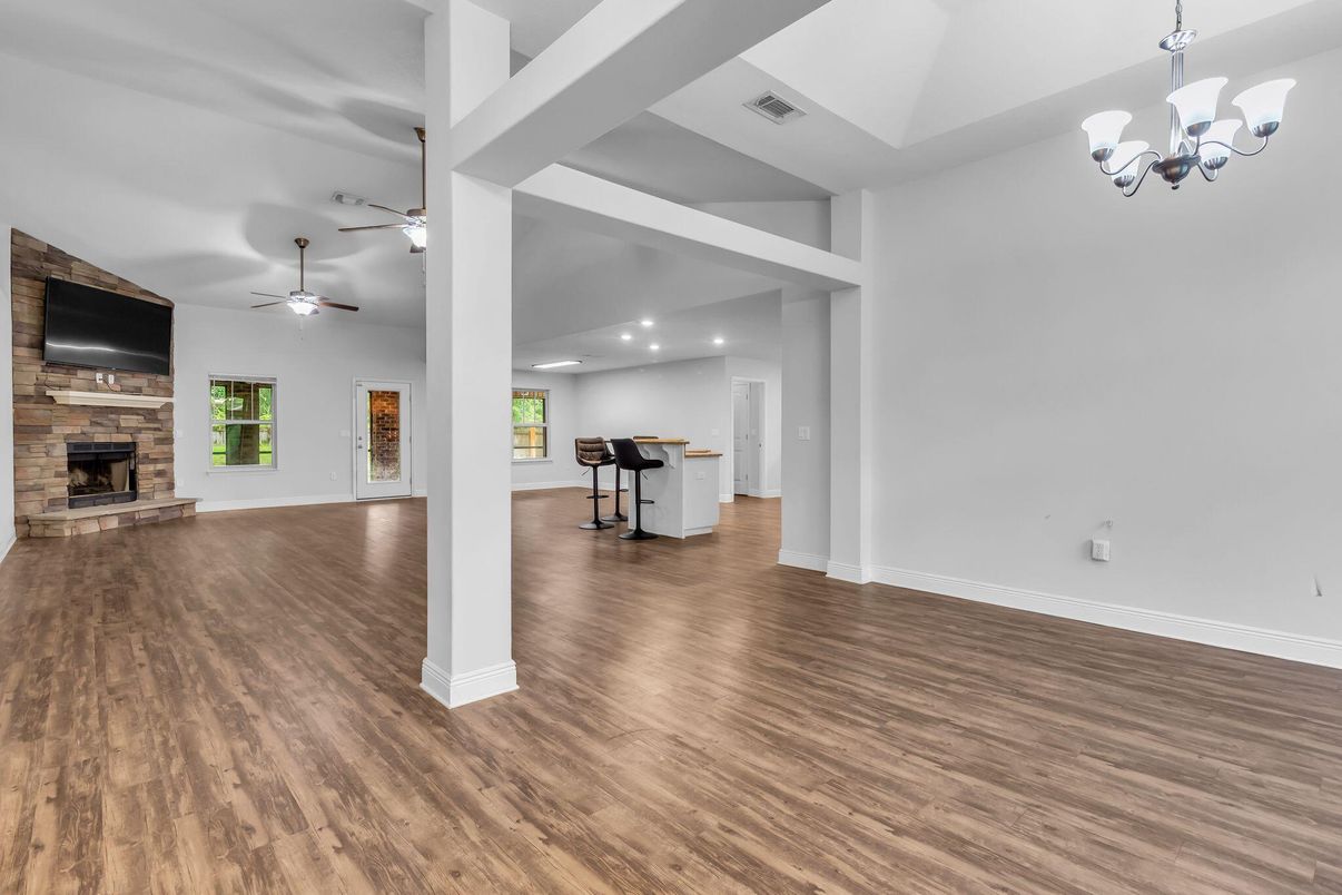 Chandelier, Empty room, Fireplace, Interior, Recessed Lighting, Wood Texture Flooring