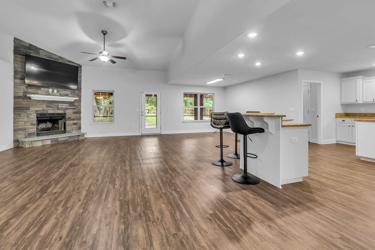 Fireplace, Interior, Recessed Lighting, Stone Walls, Wood Texture Flooring