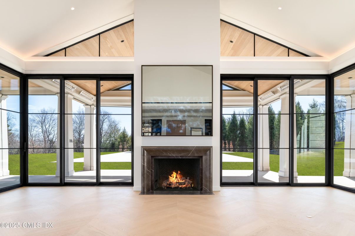 Fireplace, Interior, Recessed Lighting, Sun Room, Wood Texture Flooring