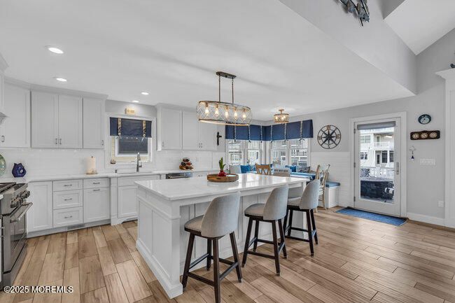 Dining room, Interior, Kitchen, Pendant Lights, Recessed Lighting, Stainless Steel Appliances, Wood Texture Flooring