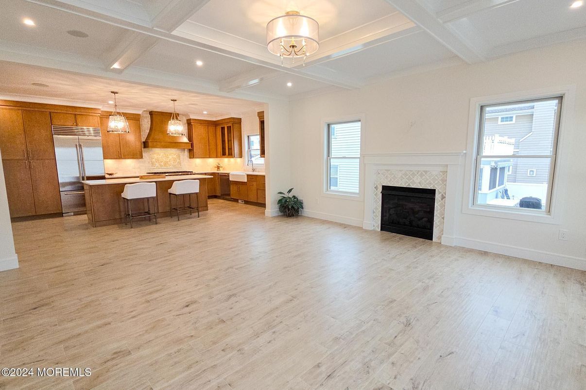 Fireplace, Interior, Kitchen, Pendant Lights, Recessed Lighting, Stainless Steel Appliances, Wood Texture Flooring