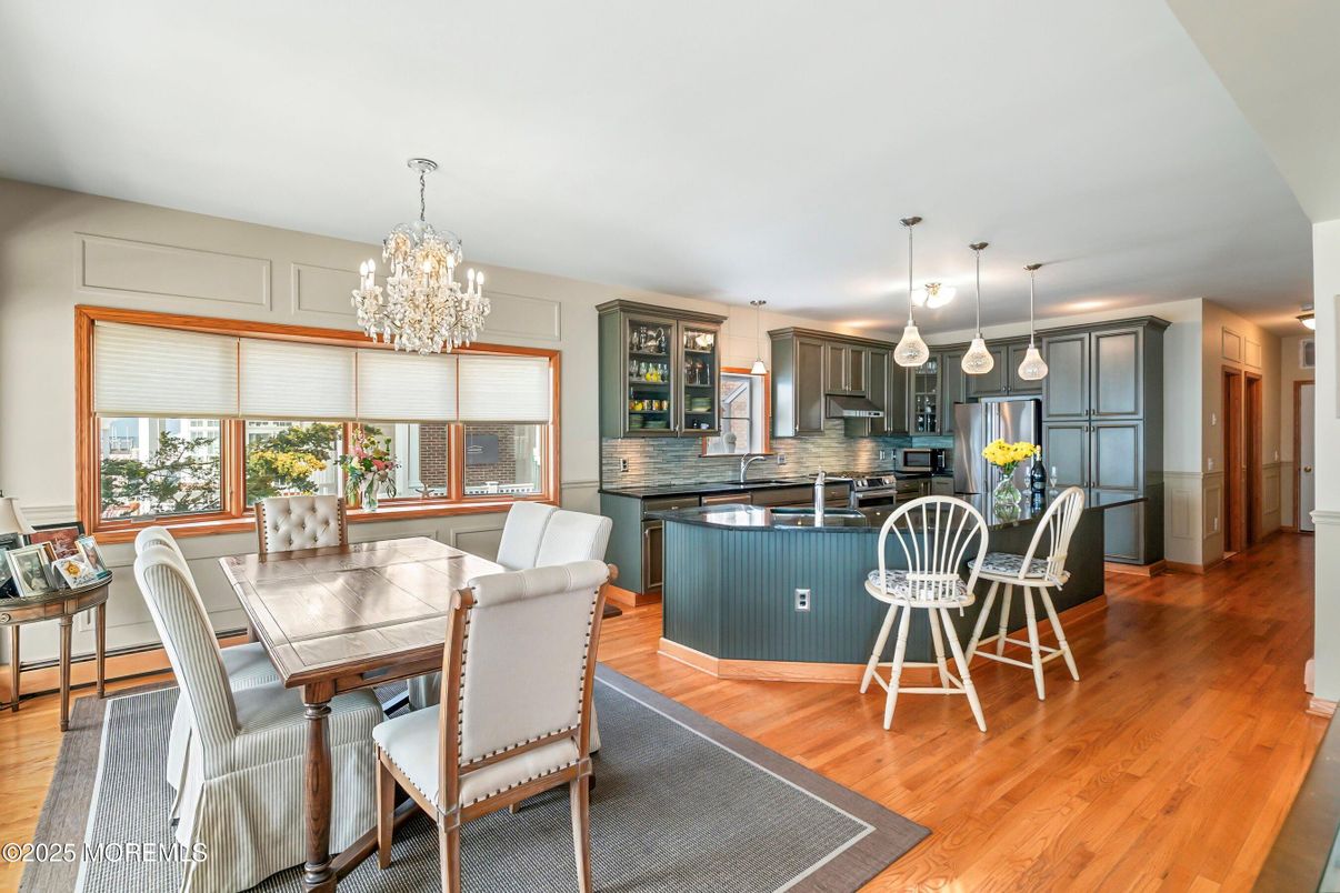 Chandelier, Dining room, Interior, Kitchen, Pendant Lights, Stainless Steel Appliances, Wood Texture Flooring