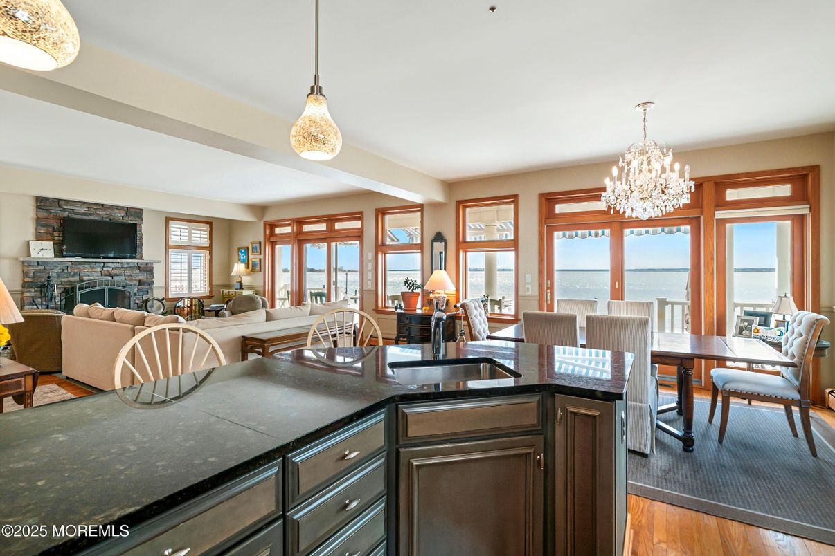 Chandelier, Dining room, Fireplace, Interior, Living room, Water, Wood Texture Flooring