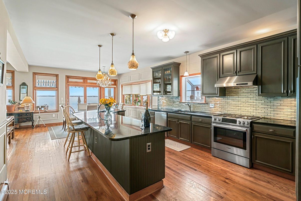 Dining room, Interior, Kitchen, Pendant Lights, Stainless Steel Appliances, Water, Wood Texture Flooring