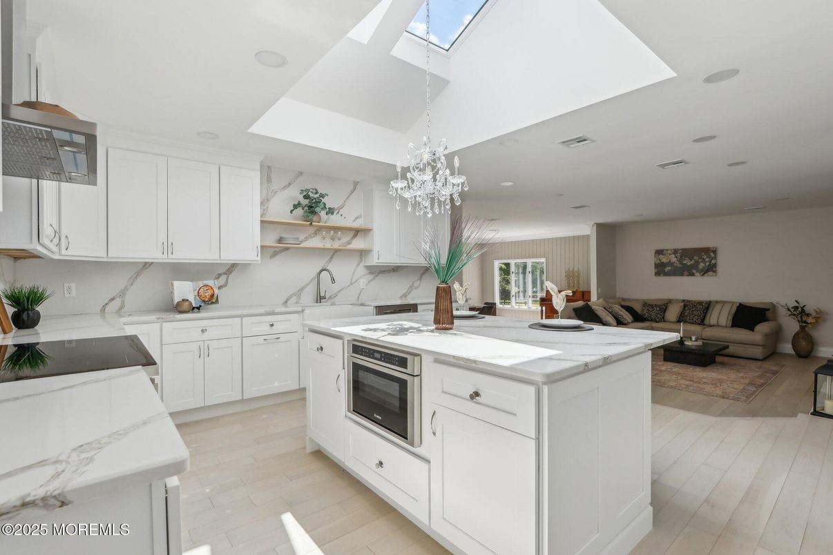 Chandelier, Interior, Kitchen, Living room, Marble Walls, Recessed Lighting, Wood Texture Flooring