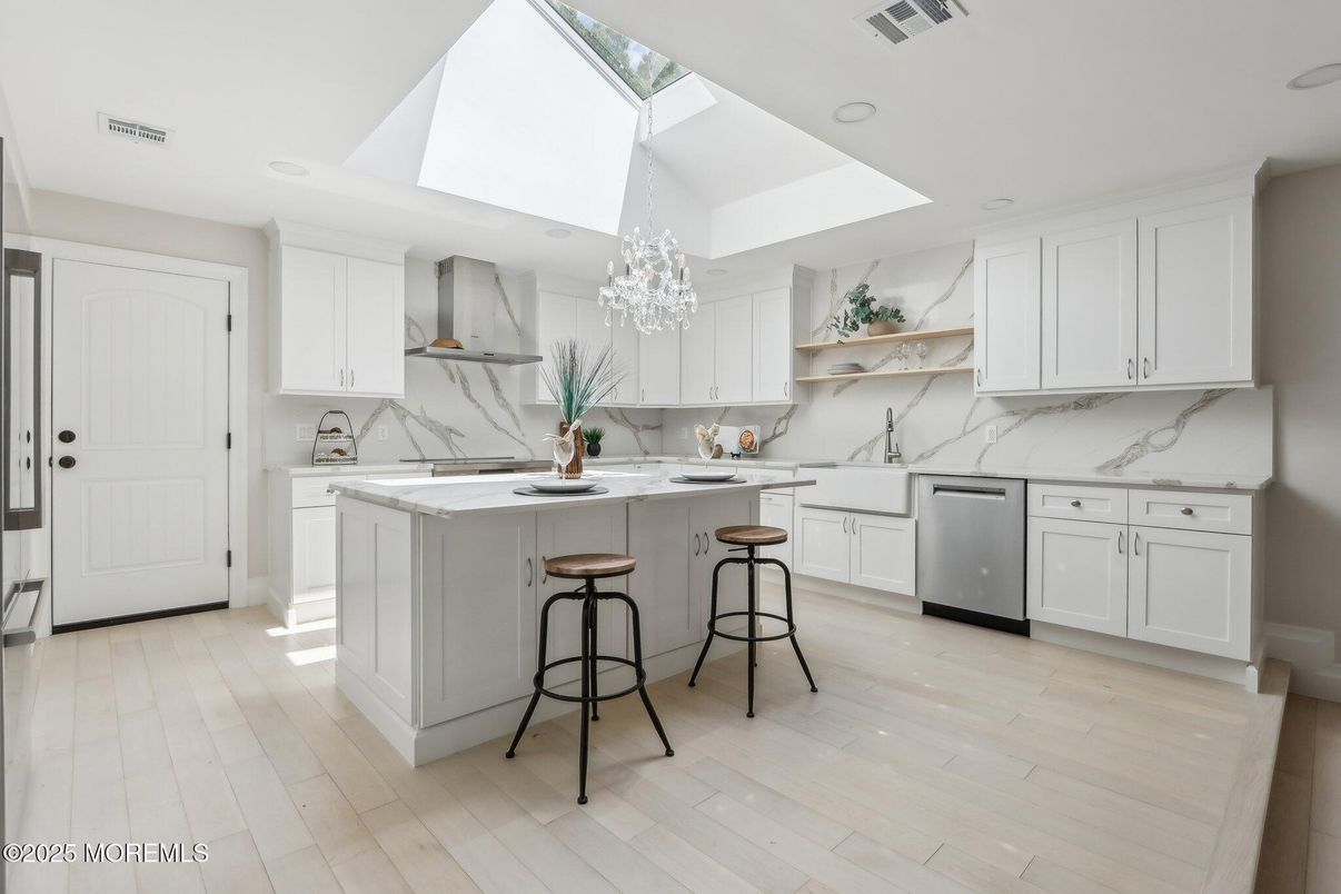 Interior, Kitchen, Marble Walls, Recessed Lighting, Stainless Steel Appliances, Wood Texture Flooring