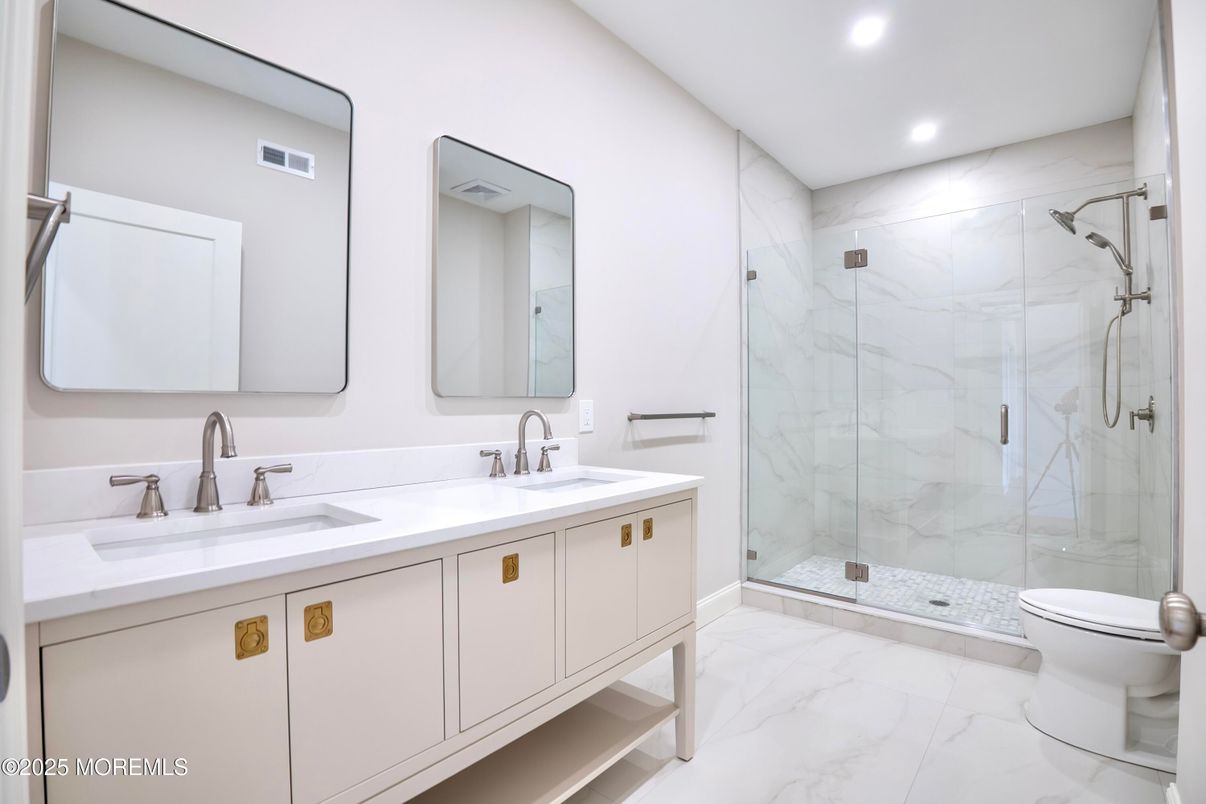 Bathroom, Dual Sink Vanities, Glass Shower, Interior, Marble, Marble Walls, Recessed Lighting