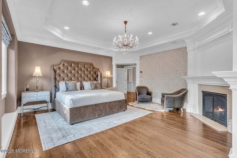 Bedroom, Chandelier, Fireplace, Interior, Recessed Lighting, Wood Texture Flooring