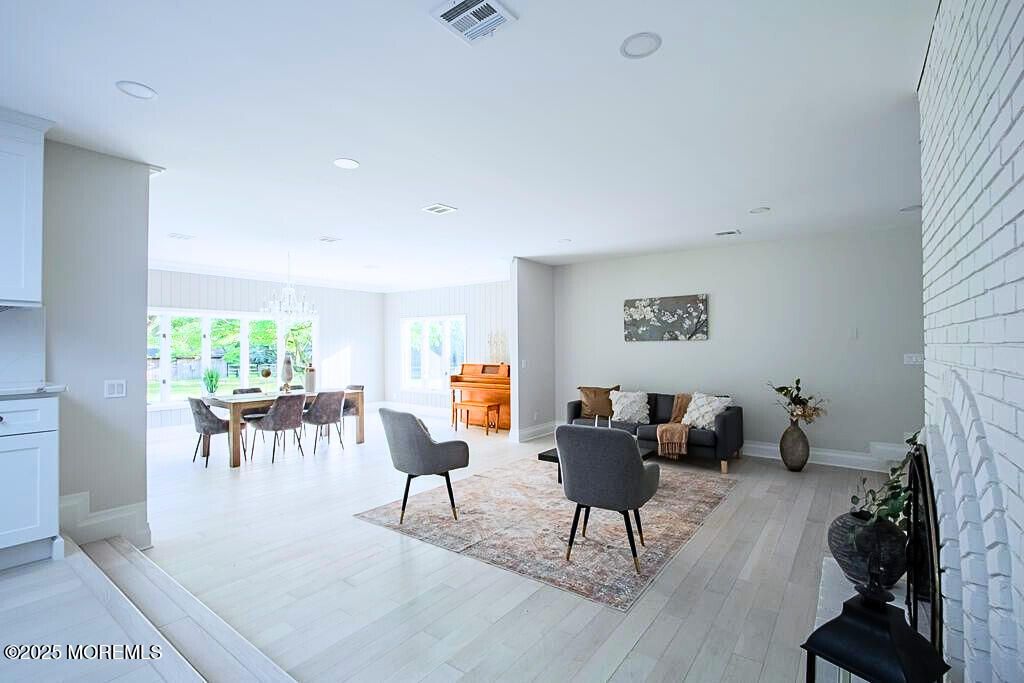 Chandelier, Dining room, Fireplace, Interior, Living room, Recessed Lighting, Wood Texture Flooring
