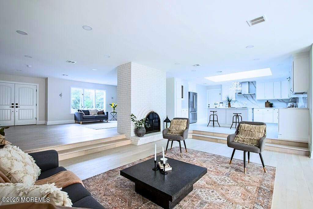 Fireplace, Interior, Kitchen, Living room, Marble Walls, Recessed Lighting, Stone Walls, Wood Texture Flooring