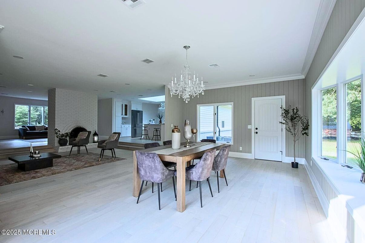 Chandelier, Dining room, Interior, Living room, Recessed Lighting, Stone Walls, Wood Texture Flooring