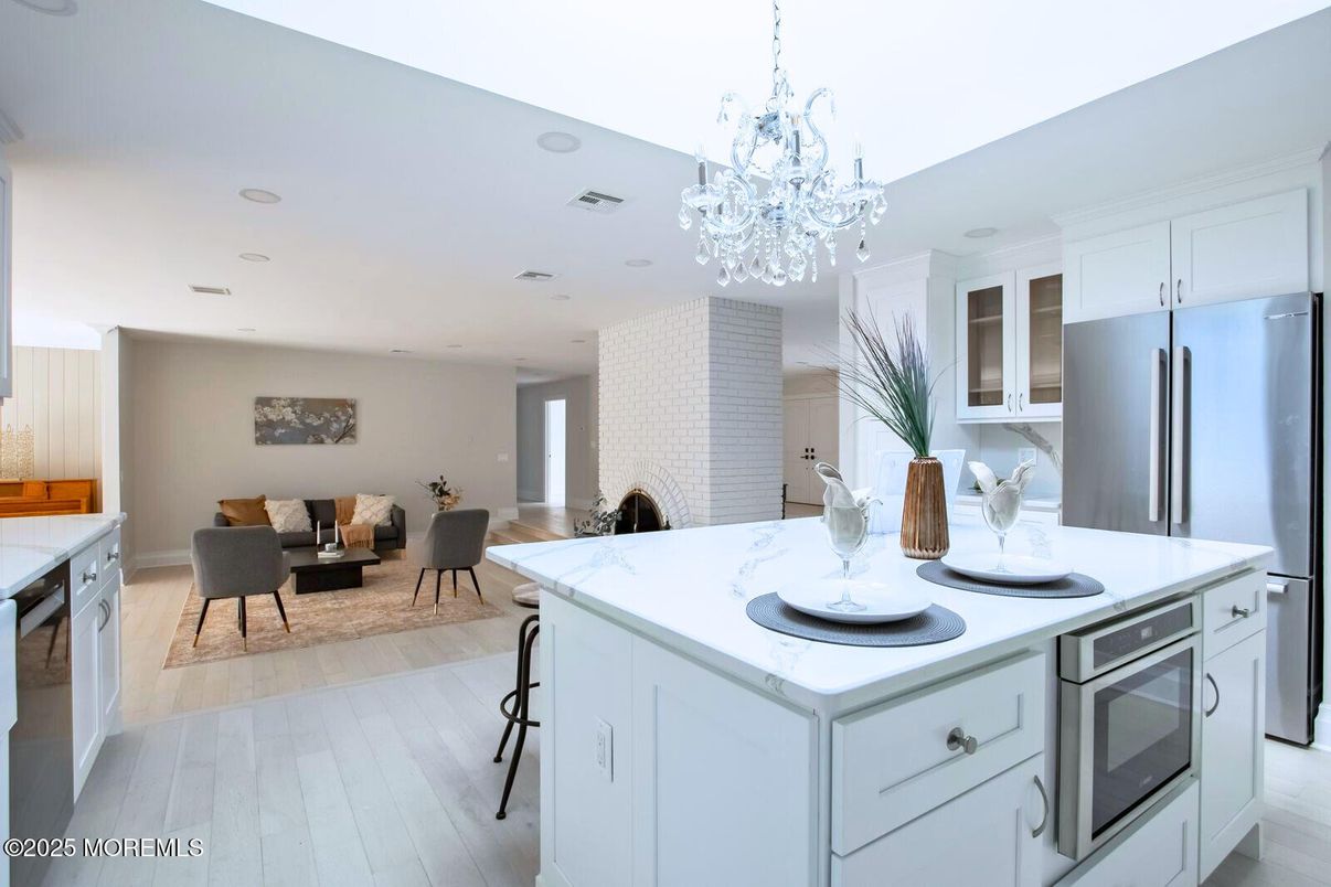 Chandelier, Dining room, Interior, Kitchen, Recessed Lighting, Stainless Steel Appliances, Wood Texture Flooring